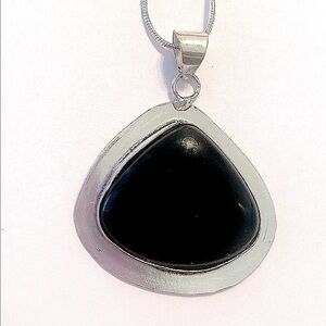 1 1/2 inch Black Onyx Pendant on a silver chain.